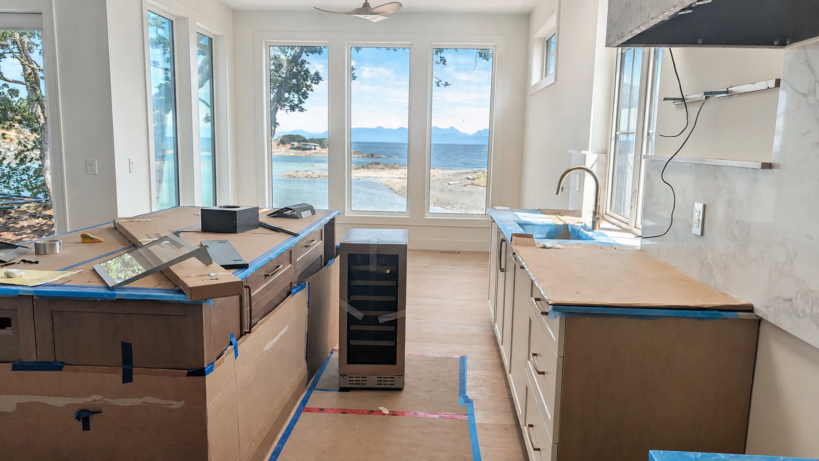 Kitchen cabinet installation in progress at a Vancouver Island home